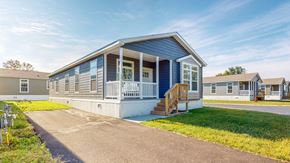 Oronoco apartment for rent - a blue and white house with a porch and a driveway