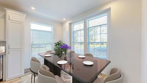 Oronoco apartment for rent - a dining room with a large window and a table with chairs