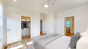 Oronoco apartment for rent - a bedroom with a bed and a closet with a closet door