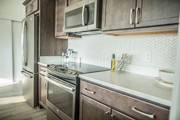 Mequon apartment for rent - a kitchen with stainless steel appliances and a counter top