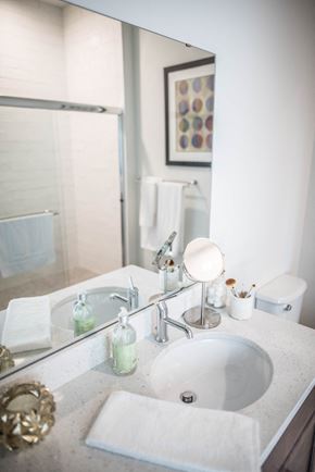 Mequon apartment for rent - a white bathroom with a sink and a mirror
