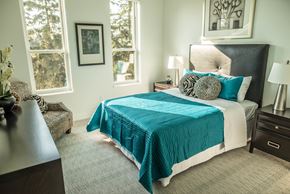 Mequon apartment for rent - a bedroom with a bed and two windows