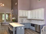 Westampton apartment for rent - a kitchen with blue and white cabinets and a table