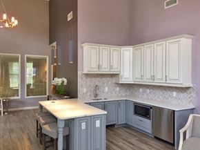 Westampton apartment for rent - a kitchen with blue and white cabinets and a table