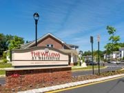 Westampton apartment for rent - the willows at weaverton sign in front of a building