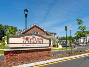 Westampton apartment for rent - the willows at weaverton sign in front of a building
