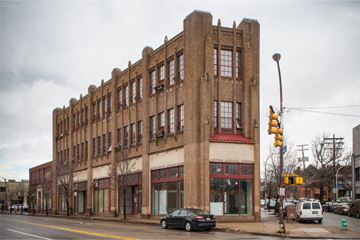 Pittsburgh apartment for rent - a large brick building on the corner of a city street