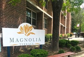 Jellico apartment for rent - a magnolia terrace sign in front of a brick building