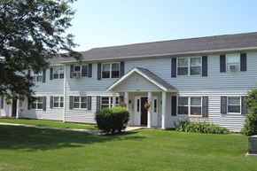 Sanborn apartment for rent - a large white house with a lawn in front of it