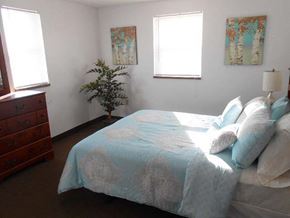 Sanborn apartment for rent - a bedroom with a bed and a dresser