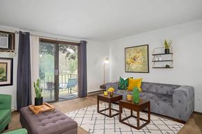 N. Tonawanda apartment for rent - a living room with a couch and a sliding glass door