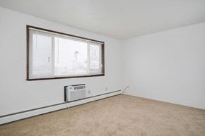 N. Falls apartment for rent - an empty room with a window and a heater