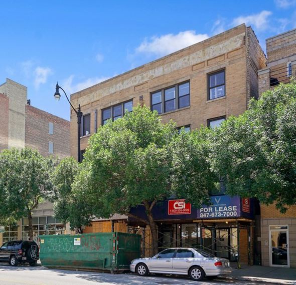 Chicago apartment for rent - a building with a car parked in front of it