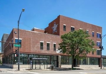 Chicago apartment for rent - A red brick building with a large star on the top floor.