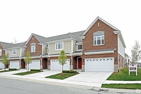 Shelby Township apartment for rent - a home is shown with a sold sign in front of it