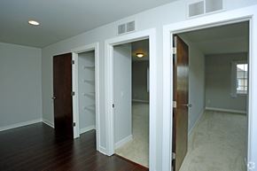 Shelby Township apartment for rent - a bedroom with three closets and a door to a closet