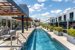 Jersey City apartment for rent - A long rectangular pool with a metal railing on the side.