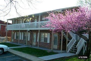 Liberty apartment for rent - A building with a tree in front of it.