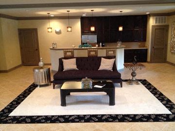 Enterprise apartment for rent - a living room with a couch and a table