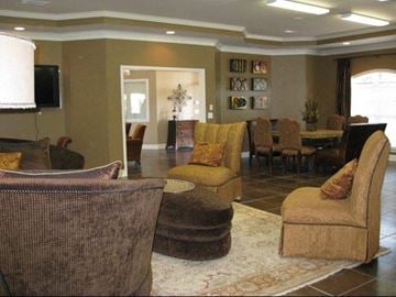 Mobile apartment for rent - a living room with couches and chairs and a table