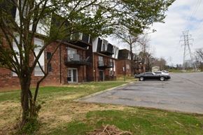 Knoxville apartment for rent - A black car is parked in a parking lot.