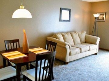 Anaheim apartment for rent - a living room with a table and a couch