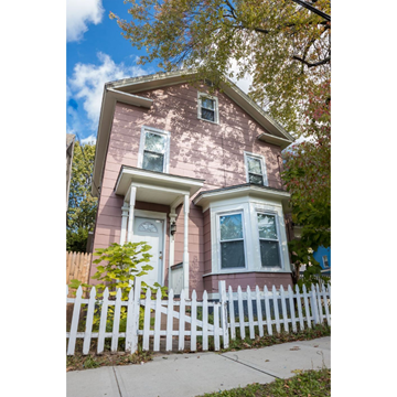 New Haven apartment for rent - A house with a white picket fence in front.