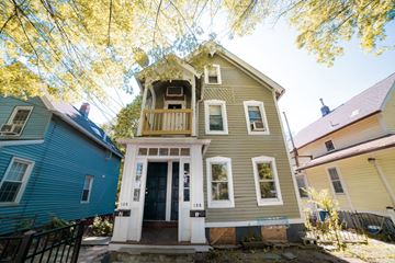 New Haven apartment for rent - A house with a blue house in front of it.