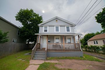 New Haven apartment for rent - A two-story house with a front porch and a small front yard.