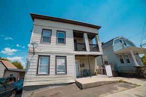 West Haven apartment for rent - A two-story house with a balcony on the second floor.