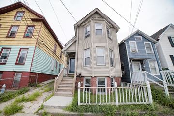 New Haven apartment for rent - Three houses with different colored siding are shown.