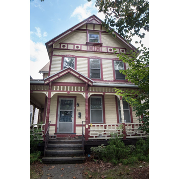 New Haven apartment for rent - A two-story house with a red door and white trim.