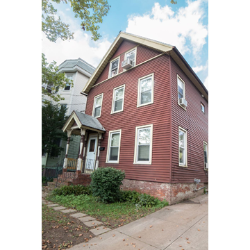 New Haven apartment for rent - A red house with a white door and windows.