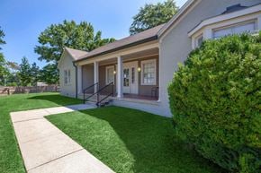 Columbia apartment for rent - the front of a white house with a yard and grass