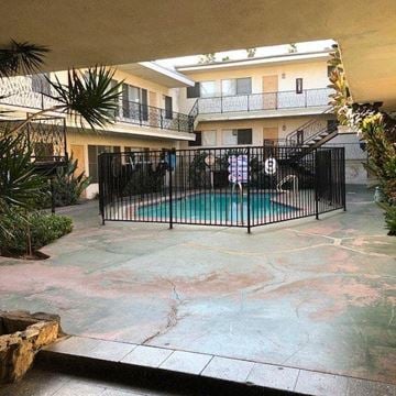 Los Angeles apartment for rent - a small pool in front of a house with a black fence