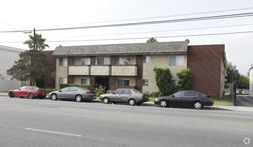 North Hollywood apartment for rent - a building with cars parked in front of it on a street