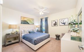 Orlando apartment for rent - a bedroom with a bed and a ceiling fan