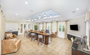 Mt. Pleasant apartment for rent - a conference room with a table and chairs and a fireplace