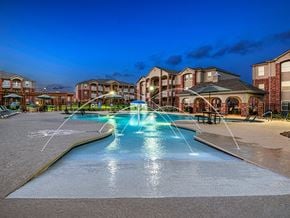 Derby apartment for rent - the preserve at ballantyne commons pool with water fountain at night