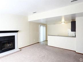 Toledo townhouse for rent - an empty living room with a fireplace