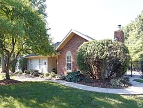 Toledo townhouse for rent - a small brick house with a yard and a sidewalk