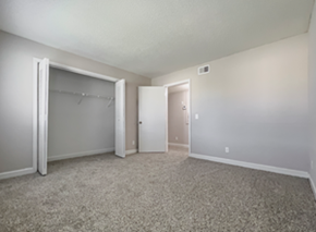 Deerfield Beach apartment for rent - an empty living room with a closet and a door to a hallway