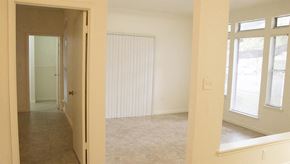 Deerfield Beach apartment for rent - an empty living room with a door to a bedroom