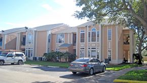 Deerfield Beach apartment for rent - a row of houses with cars parked in front of them
