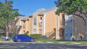 Deerfield Beach apartment for rent - a blue car parked in front of an apartment building