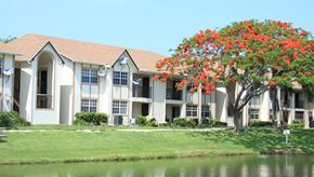 Deerfield Beach apartment for rent - a large apartment building next to a body of water