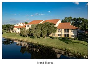 Greenacres apartment for rent - a rendering of a building next to a body of water