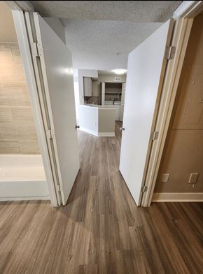 Greenacres apartment for rent - A hallway with a white door on the left and a brown door on the right.