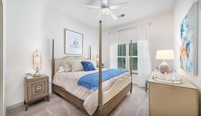 Mt. Pleasant apartment for rent - a bedroom with a large bed and a ceiling fan