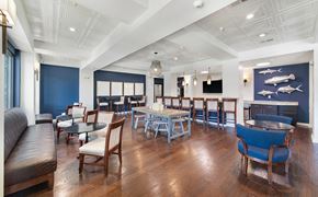 Mt. Pleasant apartment for rent - a dining room with tables and chairs and a fireplace